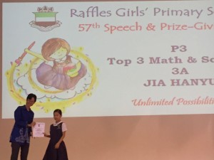 Jia Hanyu receiving her award for being Top 3 P3 Math & Science at Raffles Girls' Primary School